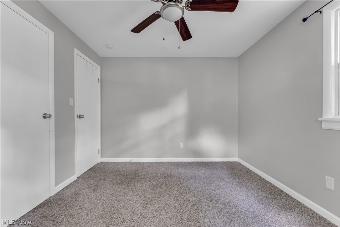 8043 Munson Road Mentor, OH 44060 - Photo 24 of 27 Empty room with carpet and ceiling fan
