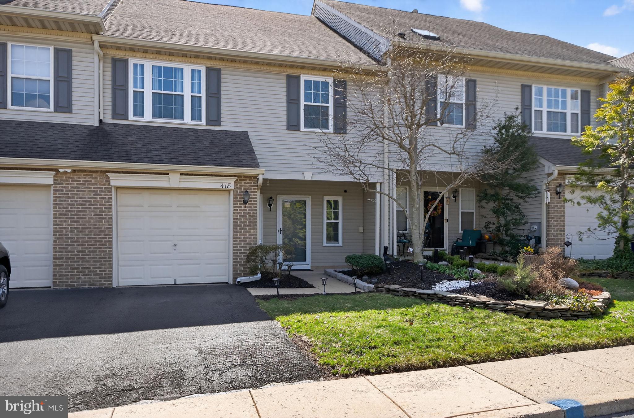 418 Fairview Way New Hope, PA 18938 - Photo 1 of 15 a front view of a brick house with a yard and plants