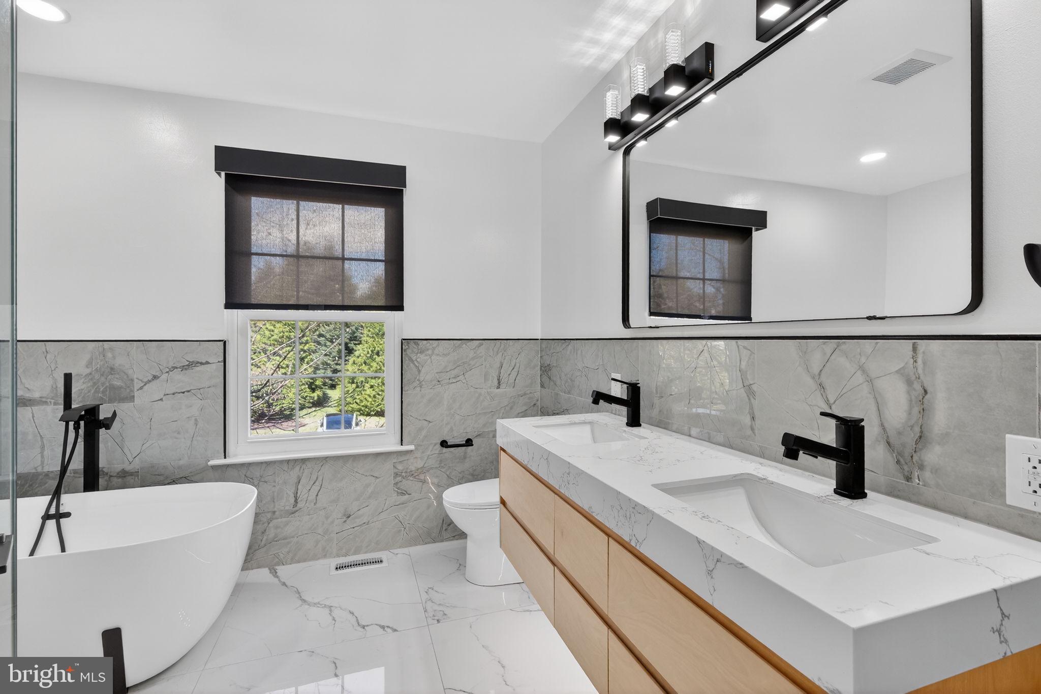 418 Fairview Way New Hope, PA 18938 - Photo 12 of 15 a bathroom with a sink a bathtub and a window