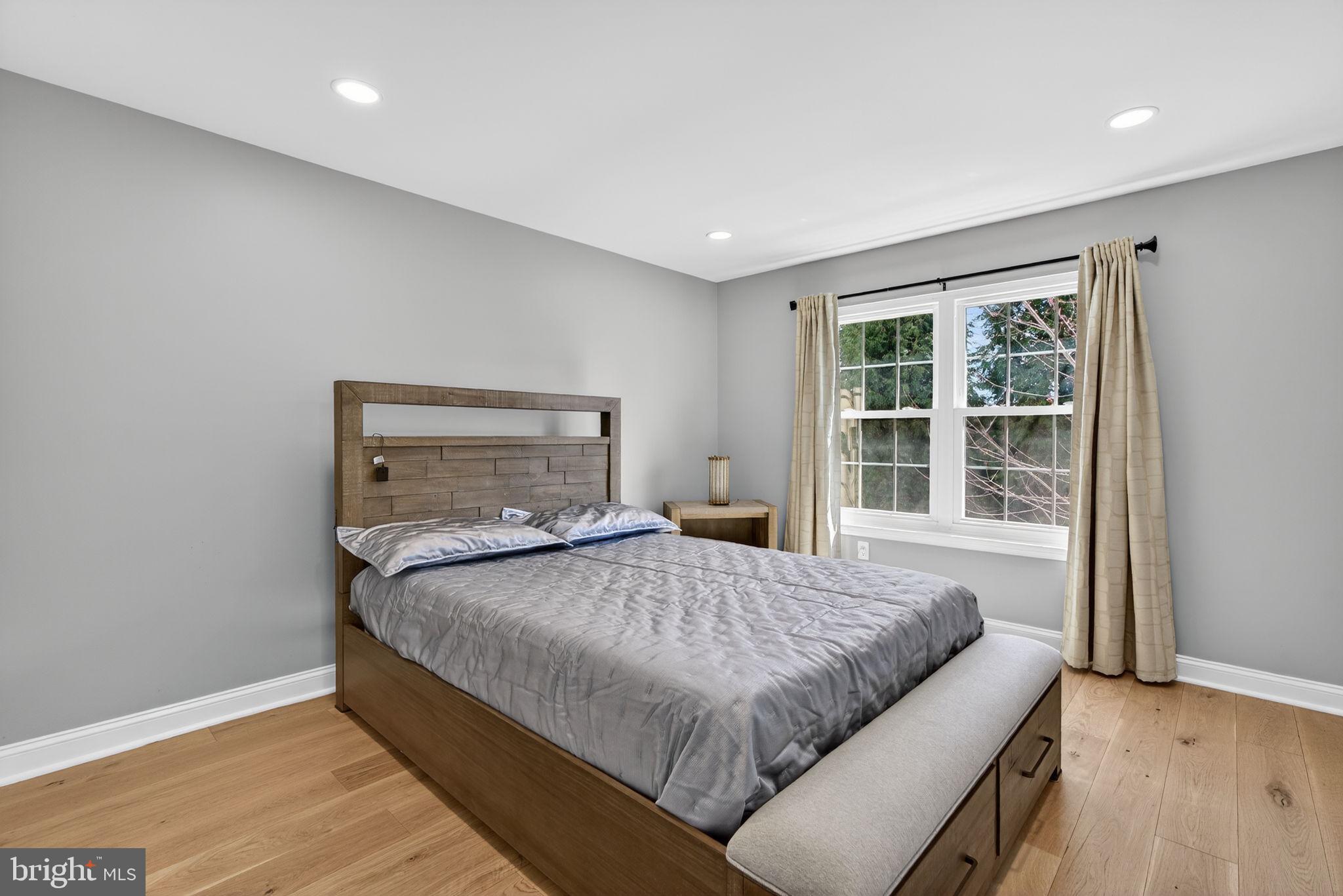 418 Fairview Way New Hope, PA 18938 - Photo 13 of 15 a bedroom with a bed and wooden floor