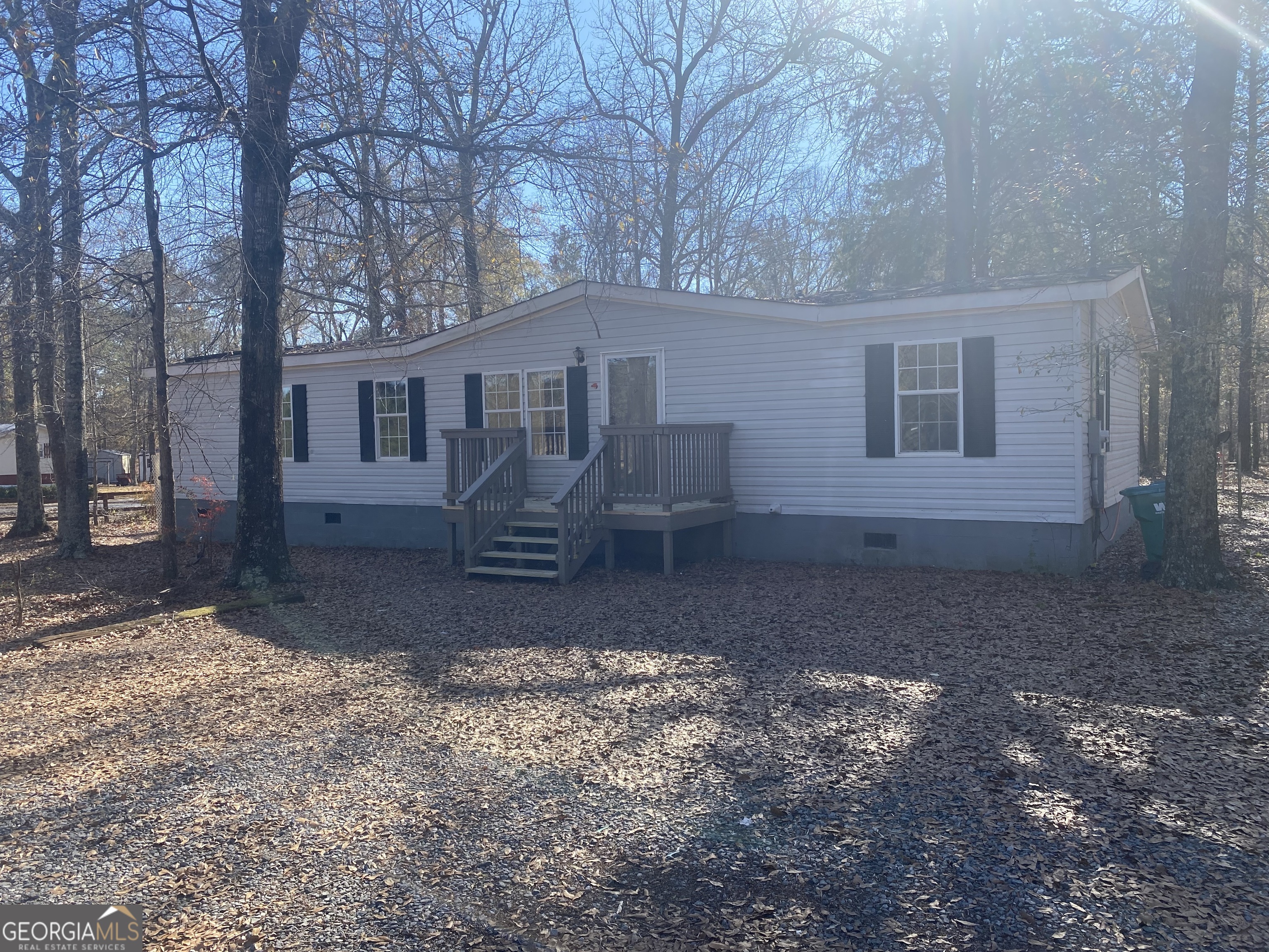 a view of a house with yard and a tree