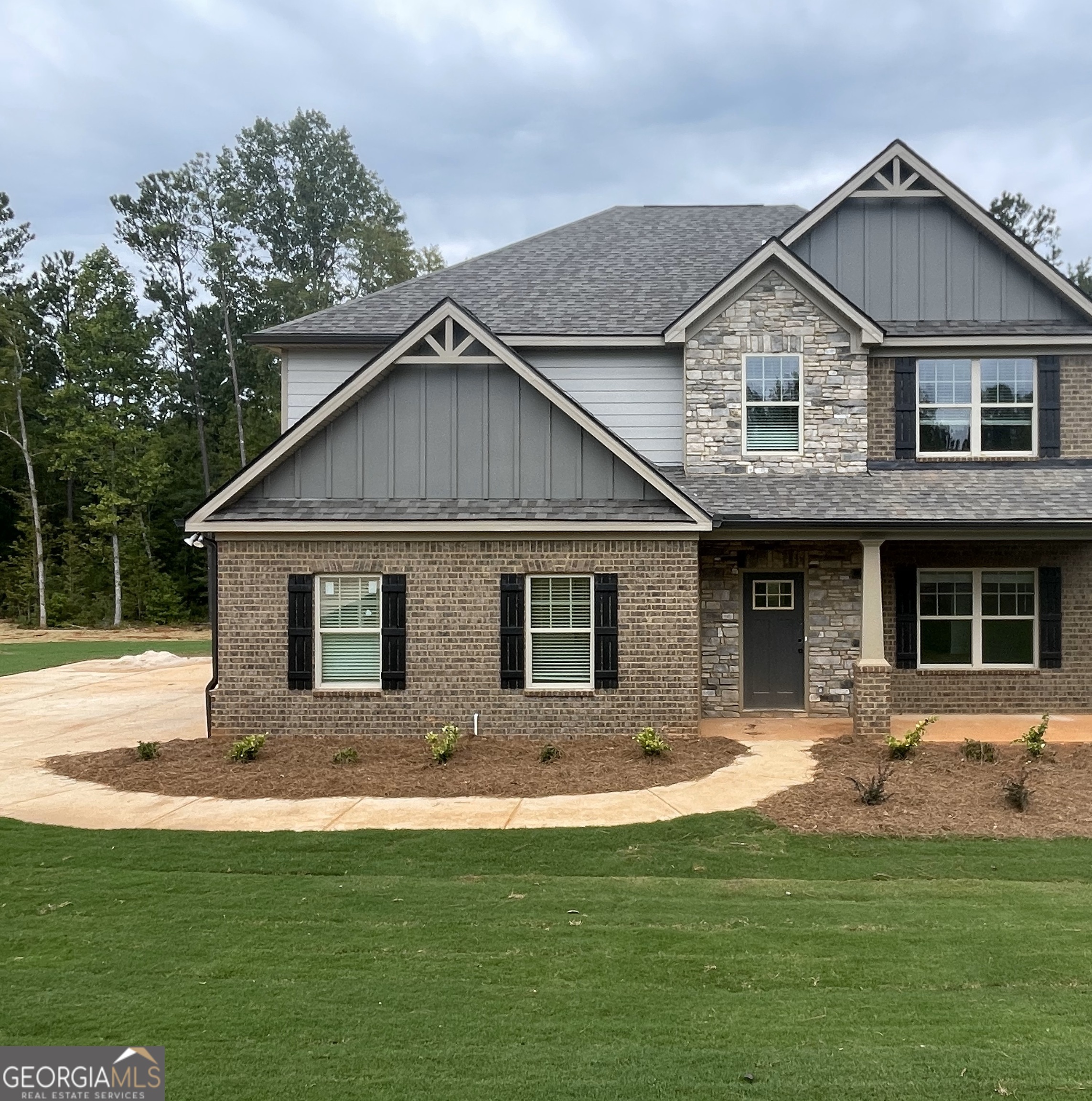 490 Homestead Circle Forsyth, GA 31029 - Photo 1 of 1 a front view of a house with a yard