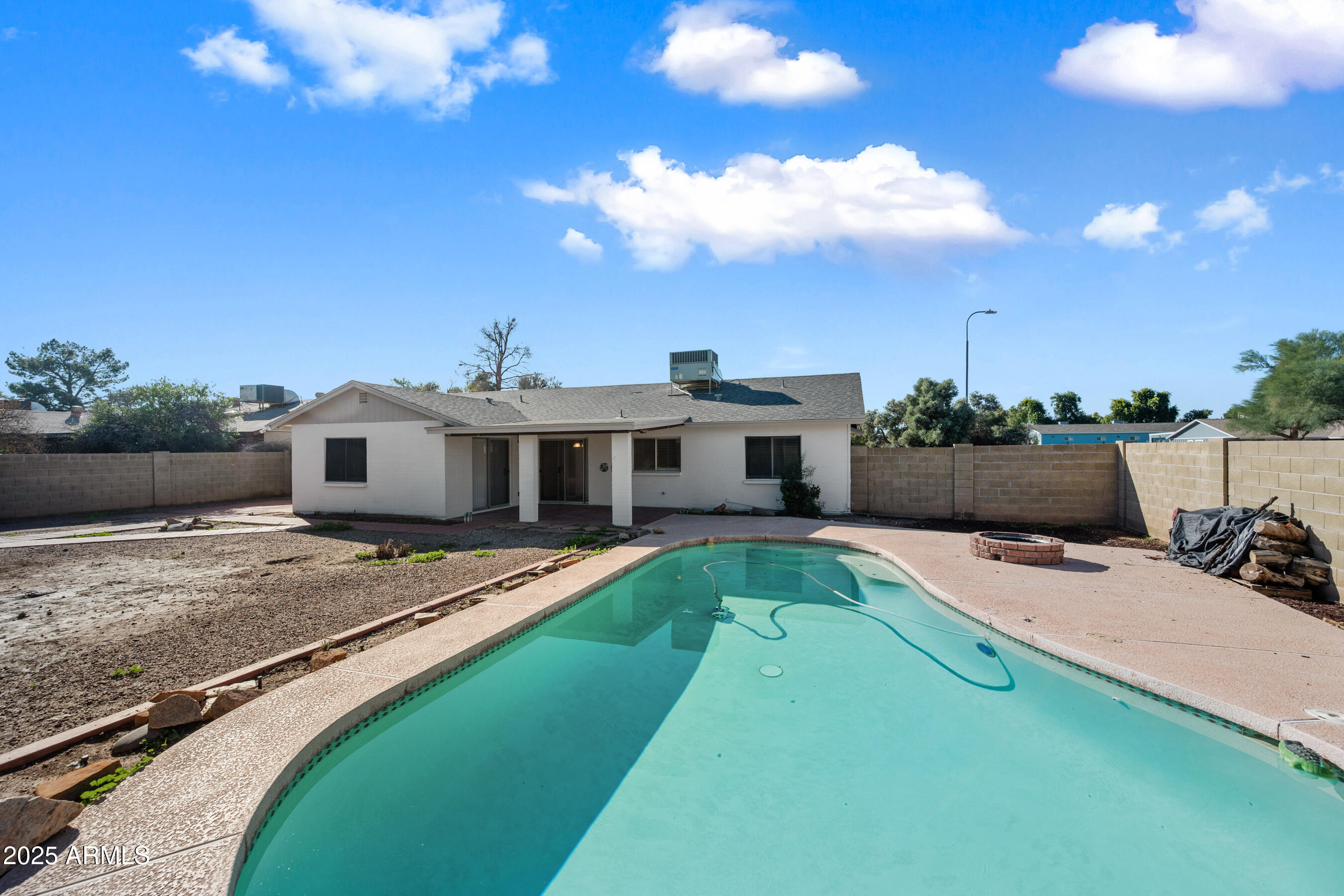 2211 North Bullmoose Drive Chandler, AZ 85224 - Photo 22 of 23 a view of a house with pool and a yard