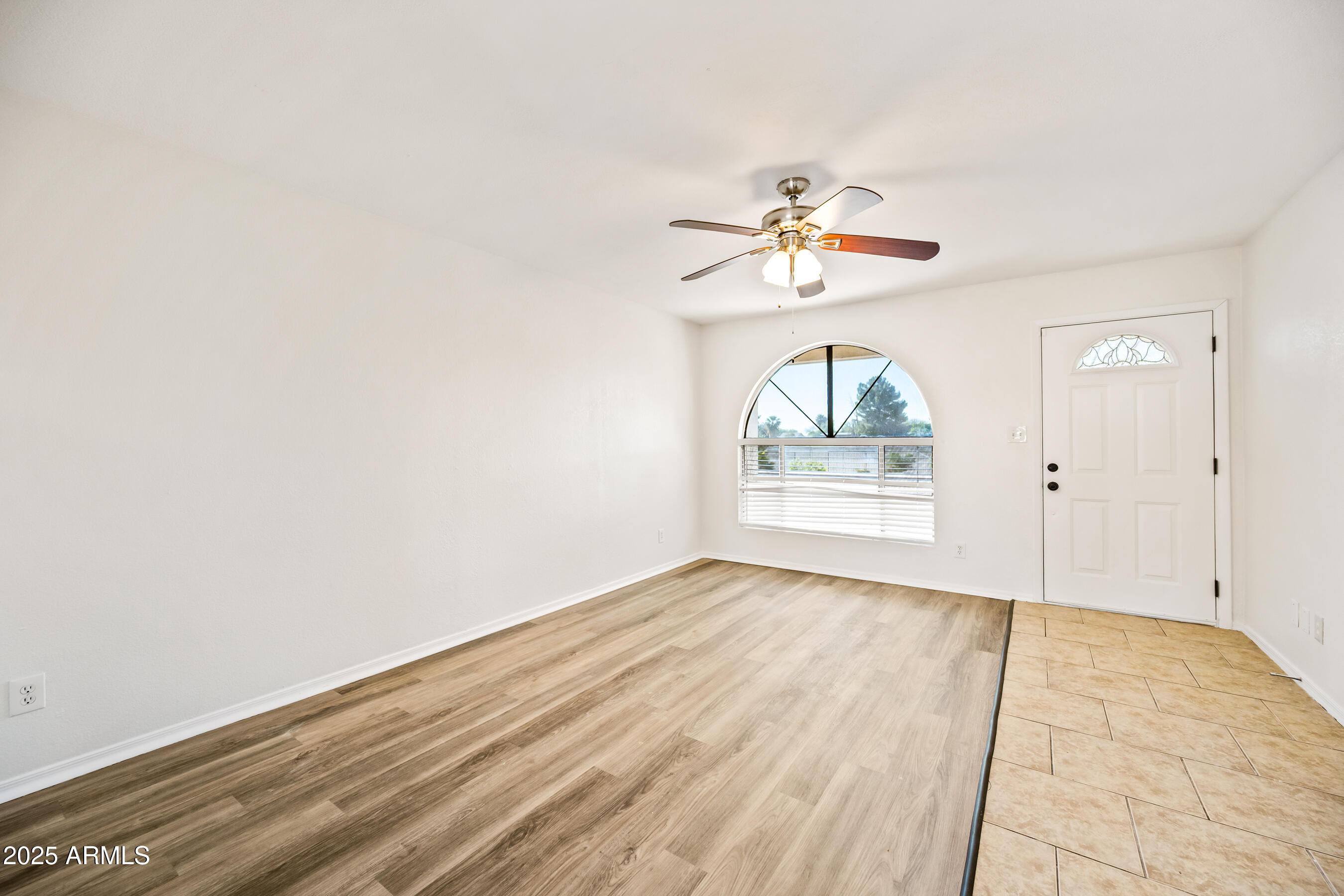 2211 North Bullmoose Drive Chandler, AZ 85224 - Photo 3 of 23 wooden floor in an empty room with a window