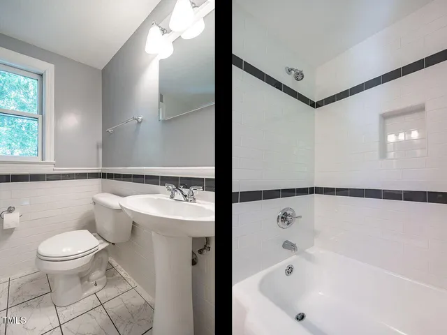 a bathroom with a bathtub and a toilet