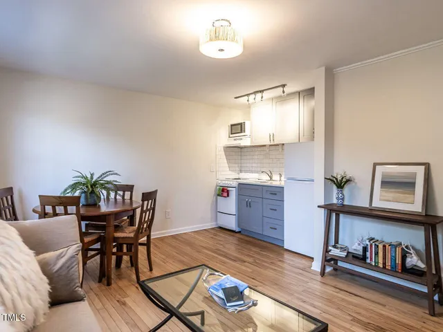 a view of a dining room with furniture and a wooden floor