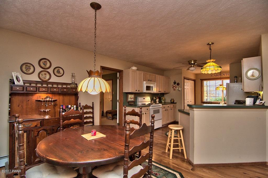 3296 Northgate Road Lake Ariel, PA 18436 - Photo 9 of 33 a view of a dining room with furniture window and wooden floor