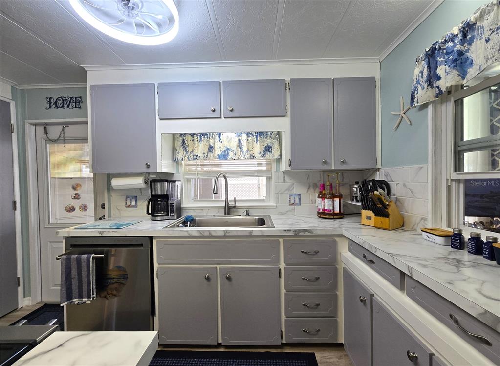 5619 Bayshore Road, Unit 435 Palmetto, FL 34221 - Photo 16 of 56 a kitchen with a sink a stove and cabinets