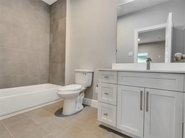 a bathroom with a toilet a sink and a bathtub