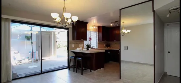 a view of a bathroom with a sink mirror and a shower