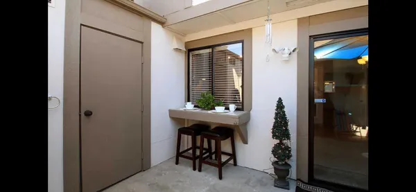 a room that has a window and a table in it