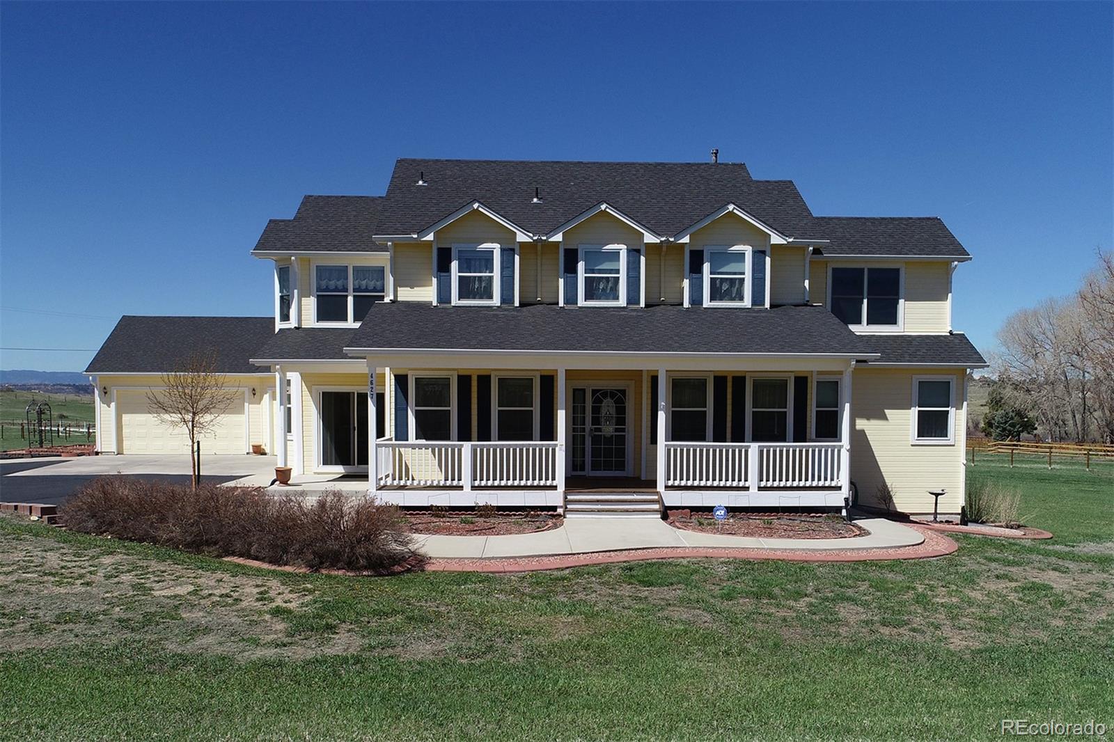 4627 Bayou Hills Road Parker, CO 80134 - Photo 1 of 40 a front view of a house with a yard