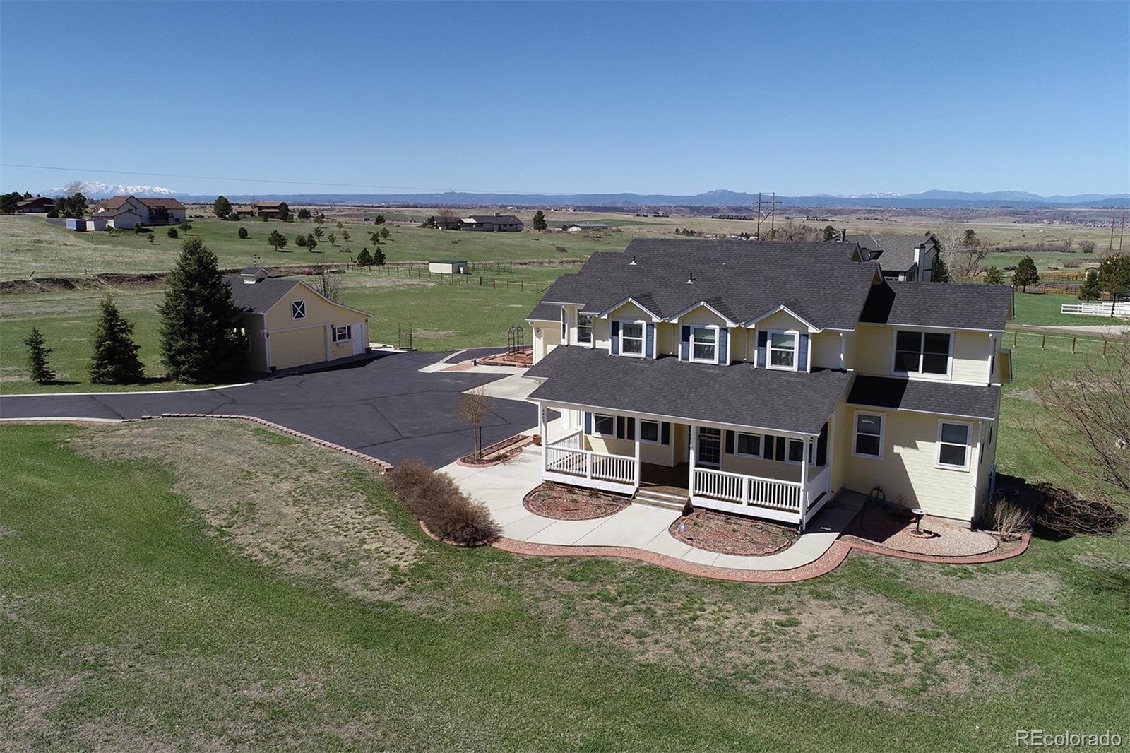 4627 Bayou Hills Road Parker, CO 80134 - Photo 2 of 40 an aerial view of a house with a garden