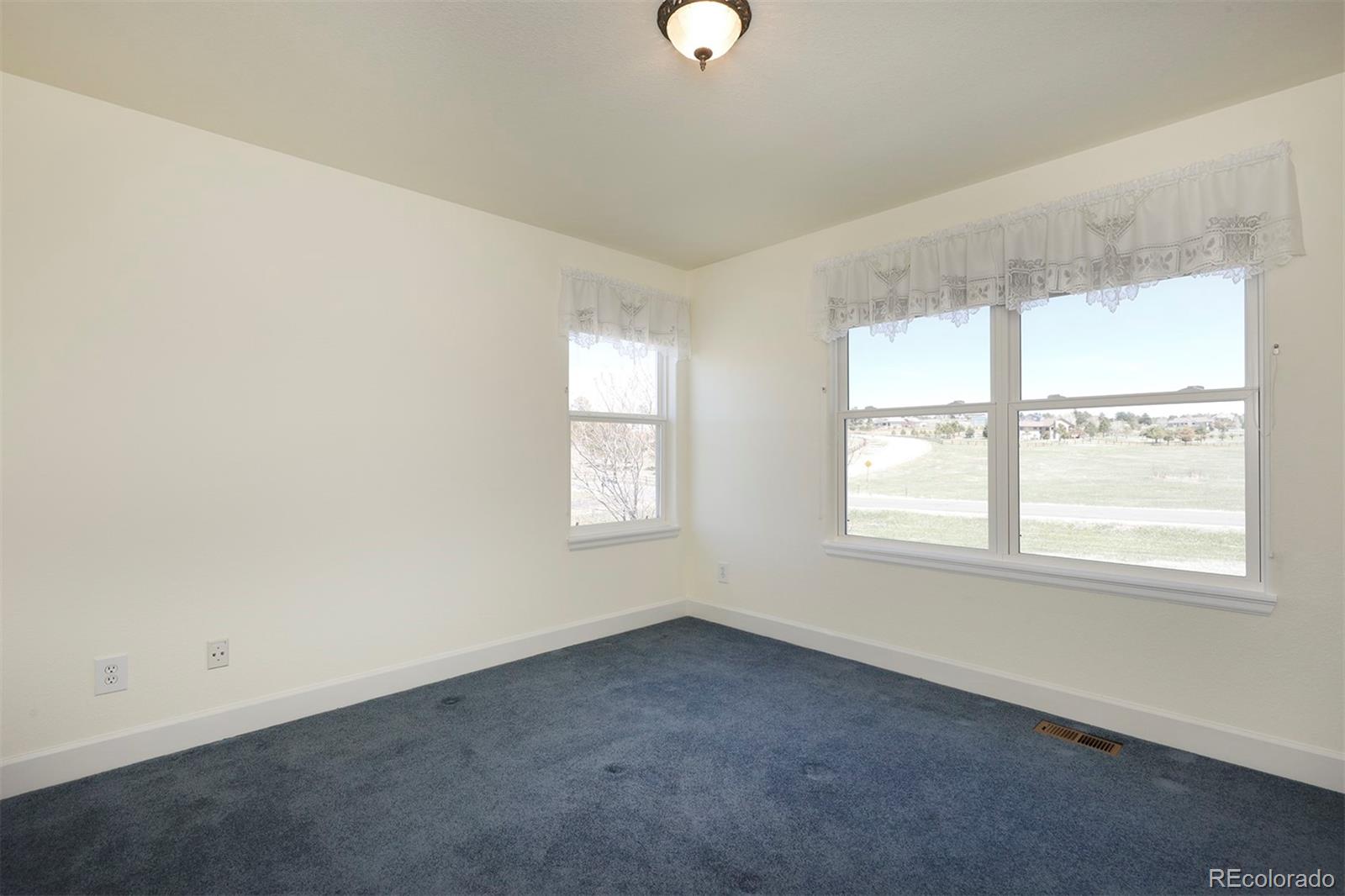 4627 Bayou Hills Road Parker, CO 80134 - Photo 21 of 40 an empty room with a window