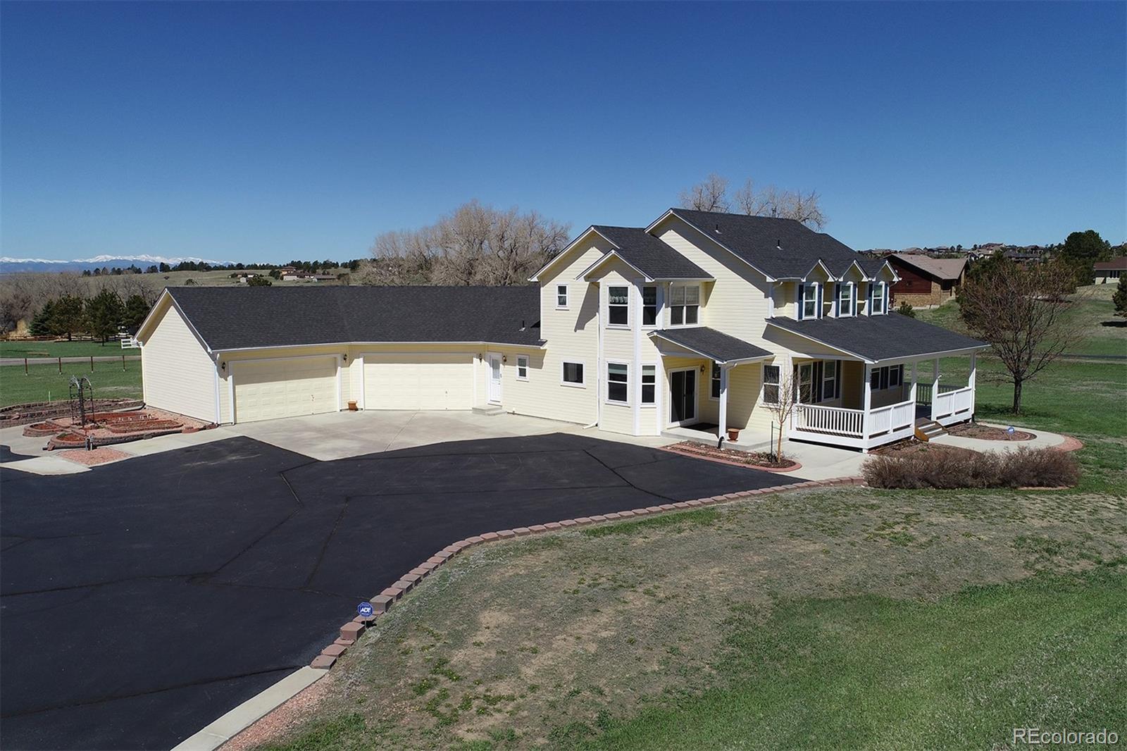 4627 Bayou Hills Road Parker, CO 80134 - Photo 25 of 40 a front view of a house with a yard