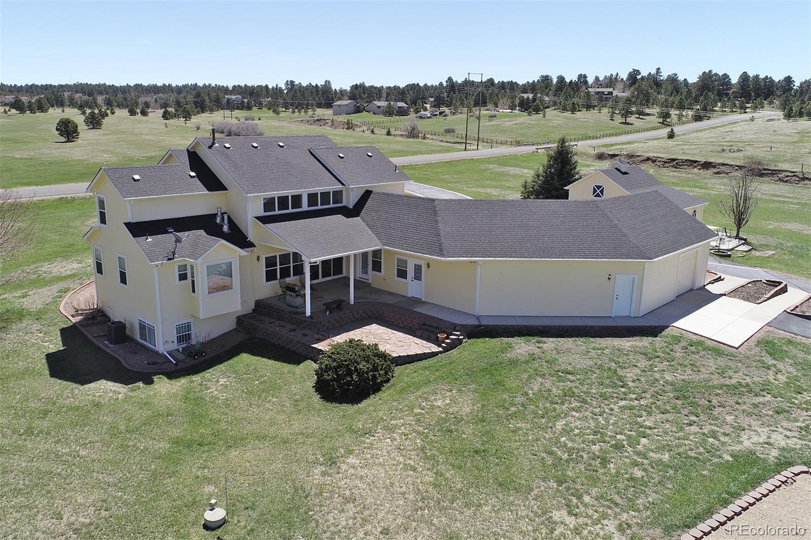 4627 Bayou Hills Road Parker, CO 80134 - Photo 27 of 40 an aerial view of a house with a yard