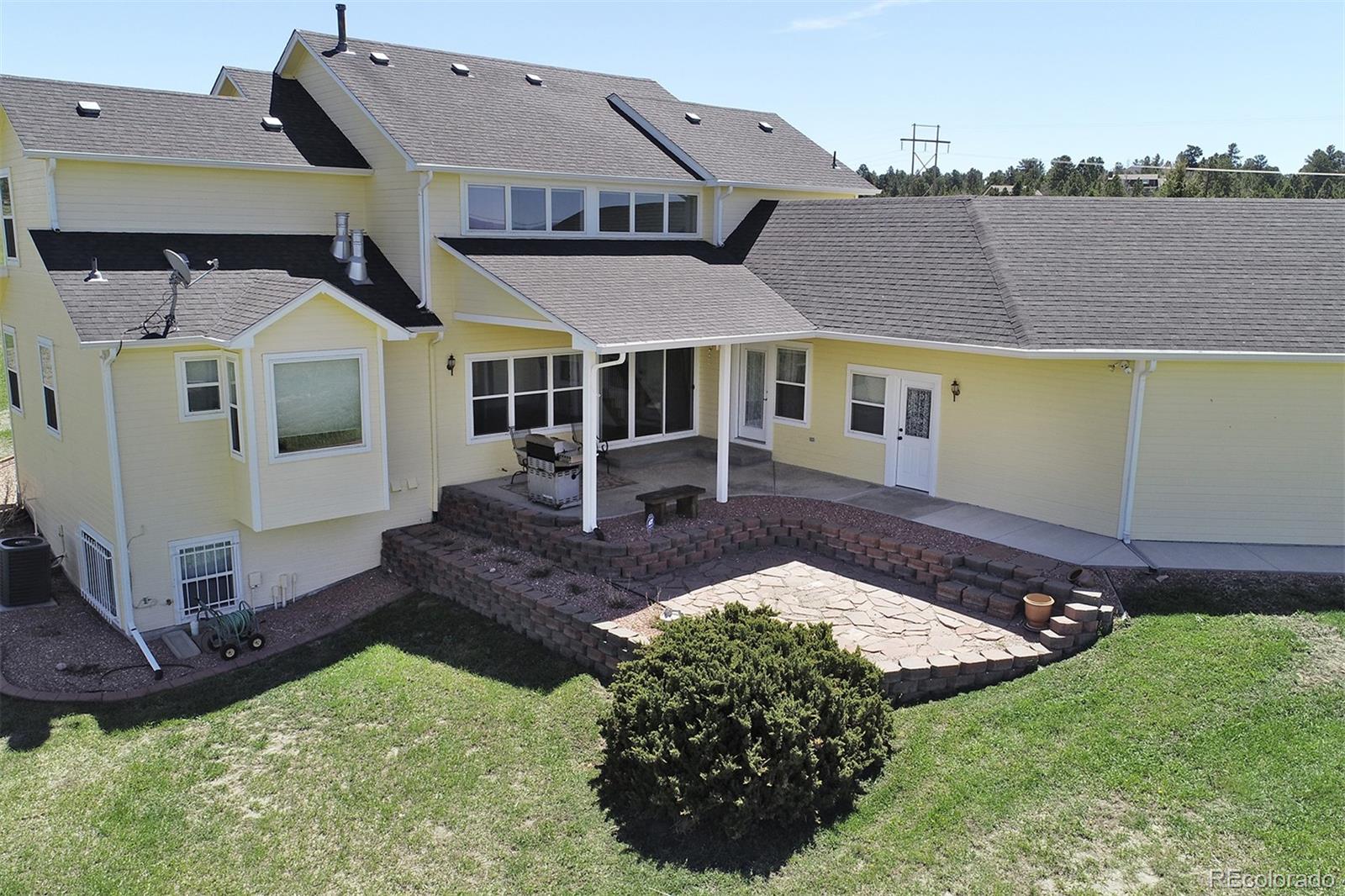 4627 Bayou Hills Road Parker, CO 80134 - Photo 28 of 40 front view of a house with a yard