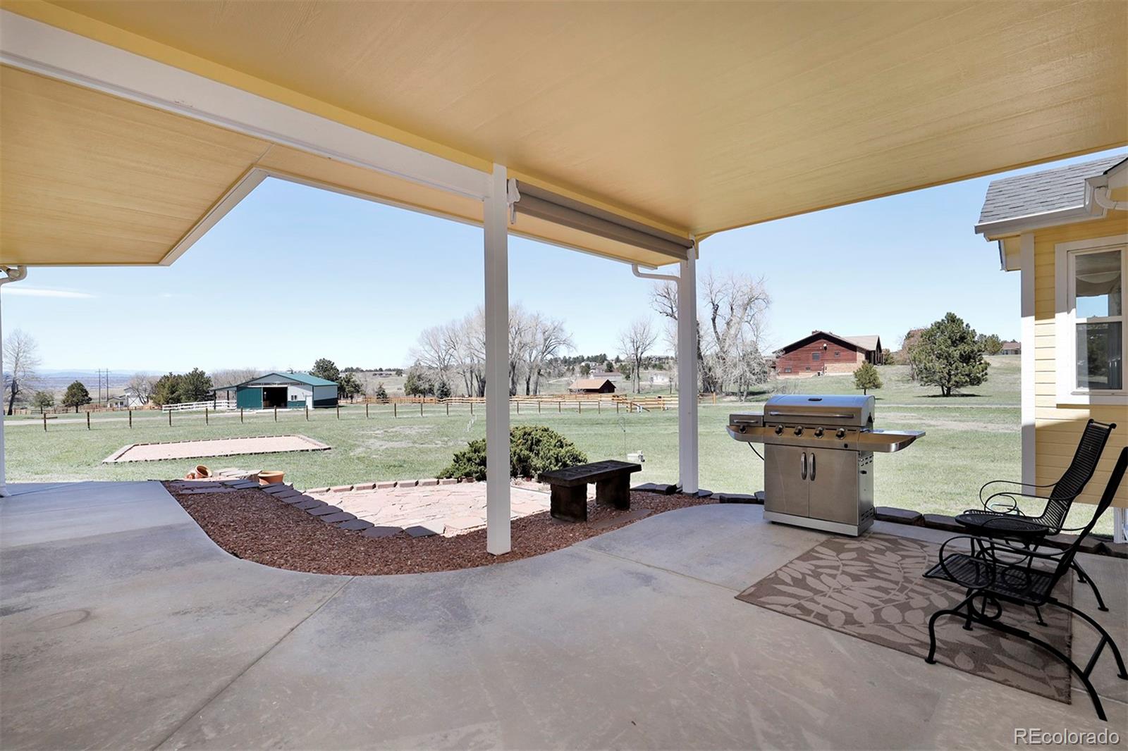 4627 Bayou Hills Road Parker, CO 80134 - Photo 29 of 40 a living room with couch and a table