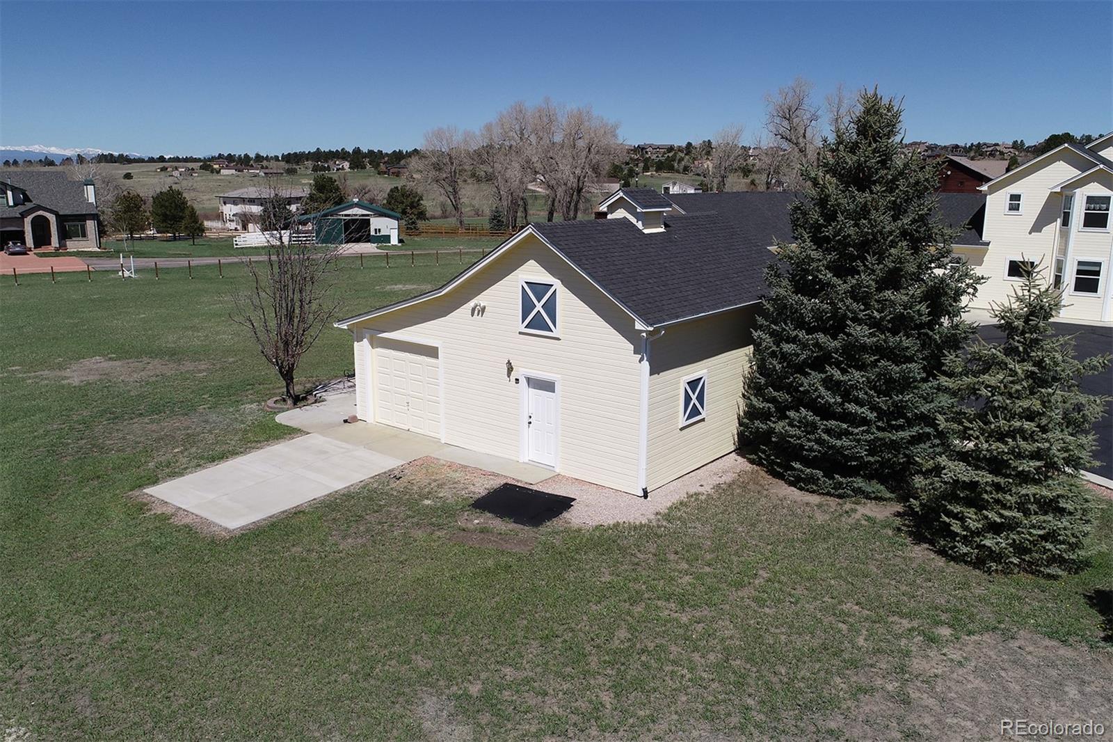 4627 Bayou Hills Road Parker, CO 80134 - Photo 32 of 40 a view of a house with a yard