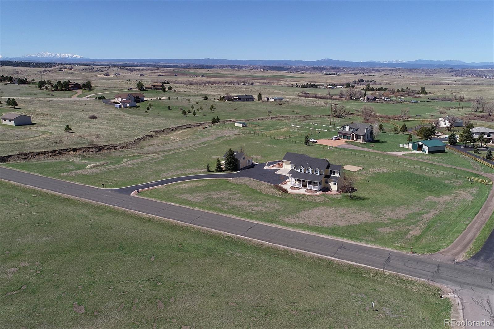 4627 Bayou Hills Road Parker, CO 80134 - Photo 36 of 40 an aerial view of a house with a yard