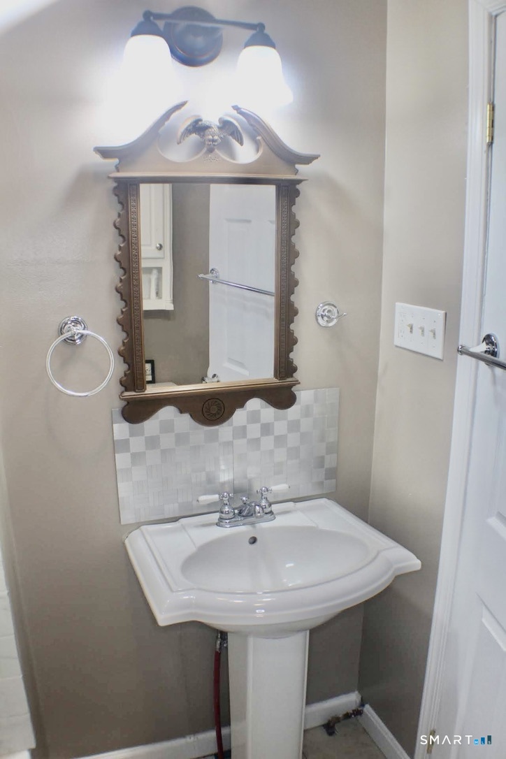 150 Whitney Street Hartford, CT 06105 - Photo 8 of 39 a bathroom with a sink and a mirror