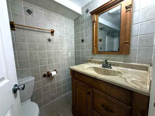 a view of a field with a tree