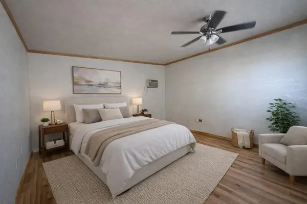 a bedroom with a bed couch and window