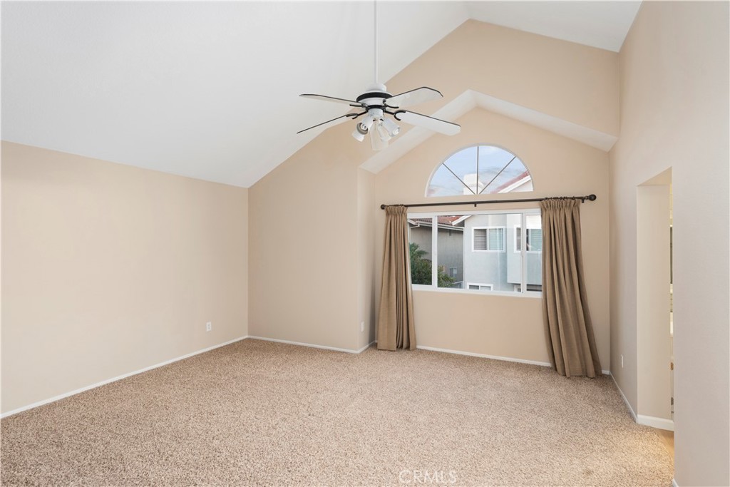 12 Rapallo Irvine, CA 92614 - Photo 11 of 21 an empty room with chandelier fan and windows