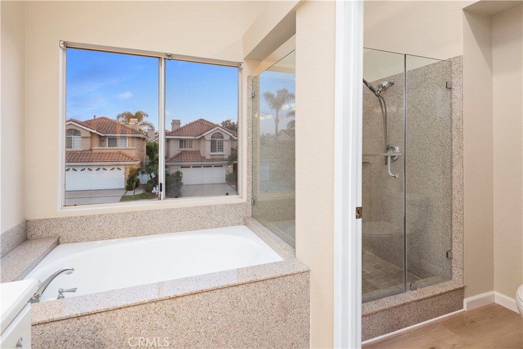 12 Rapallo Irvine, CA 92614 - Photo 13 of 21 a bathroom with a tub shower and sink