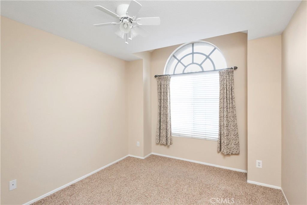 12 Rapallo Irvine, CA 92614 - Photo 16 of 21 an empty room with windows and fan