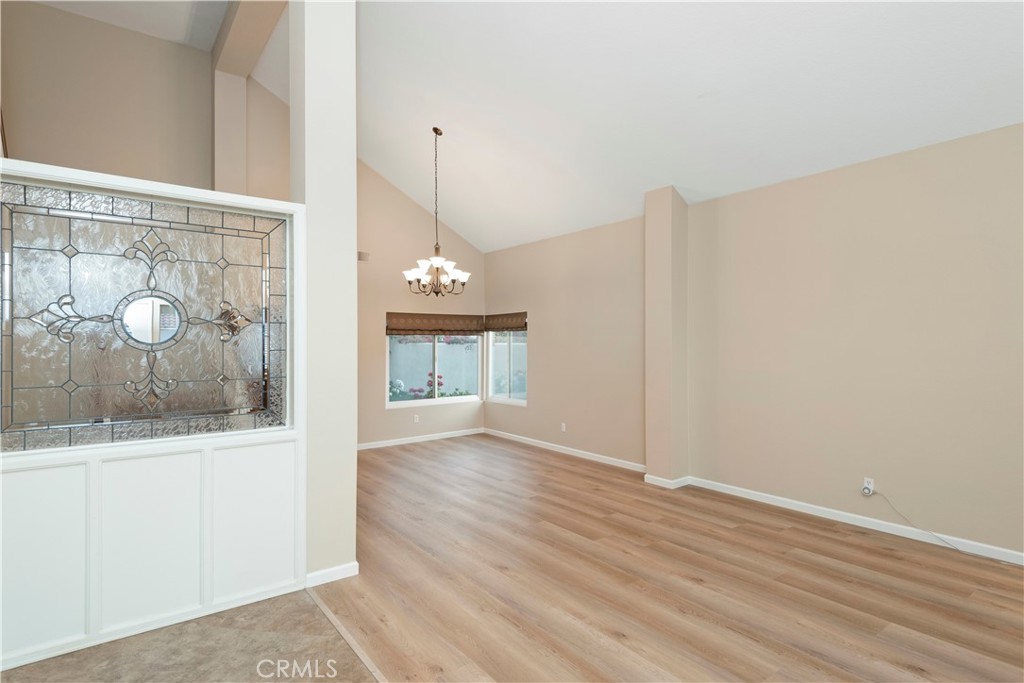 12 Rapallo Irvine, CA 92614 - Photo 2 of 21 a view of a hallway with wooden floor and a fireplace
