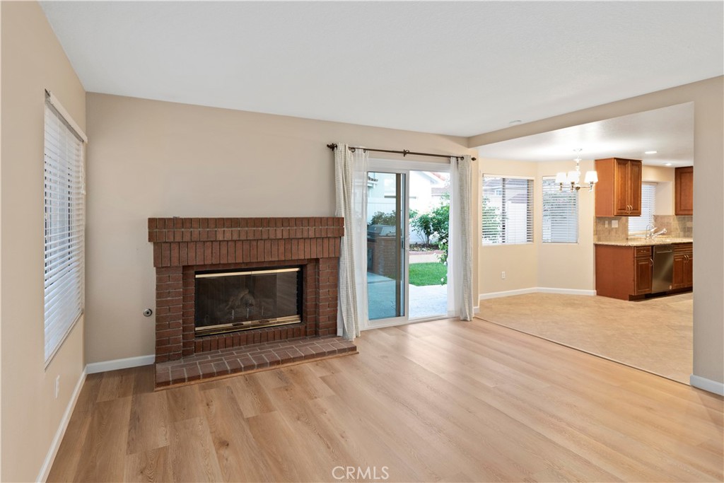 12 Rapallo Irvine, CA 92614 - Photo 6 of 21 a view of an empty room with a fireplace and a window