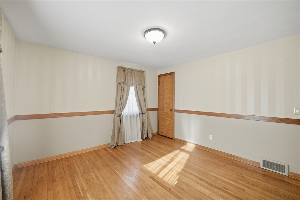 80 Jean Drive Springfield, MA 01104 - Photo 19 of 42 a view of a room with wooden floor and white walls