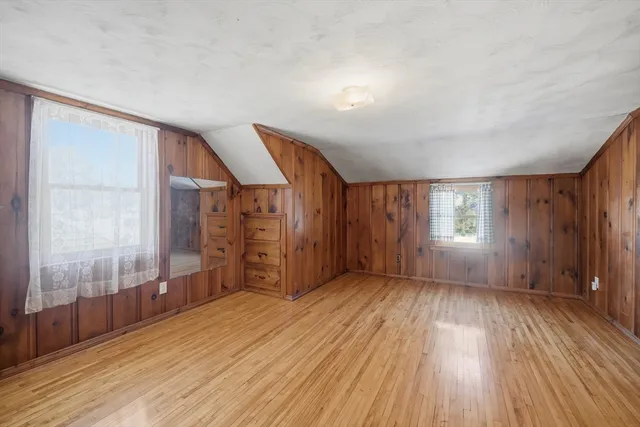 a view of wooden floor and brick walls