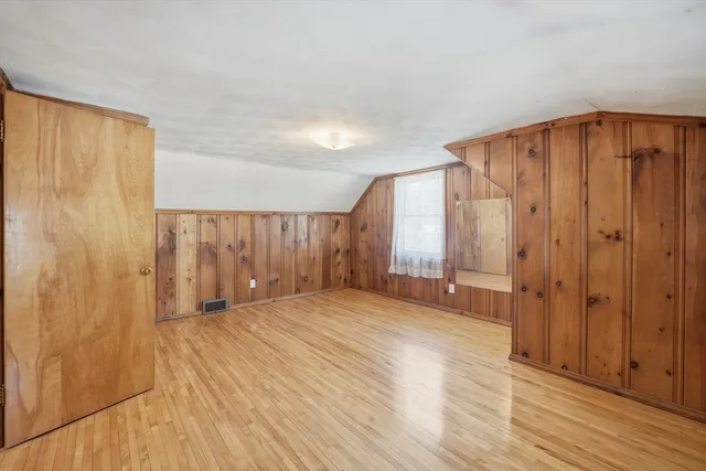 a bathroom with a sink a toilet and a window
