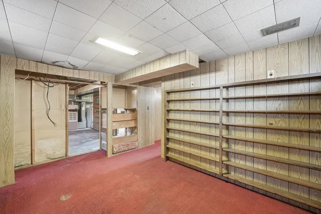 a view of a house with a snow in the yard
