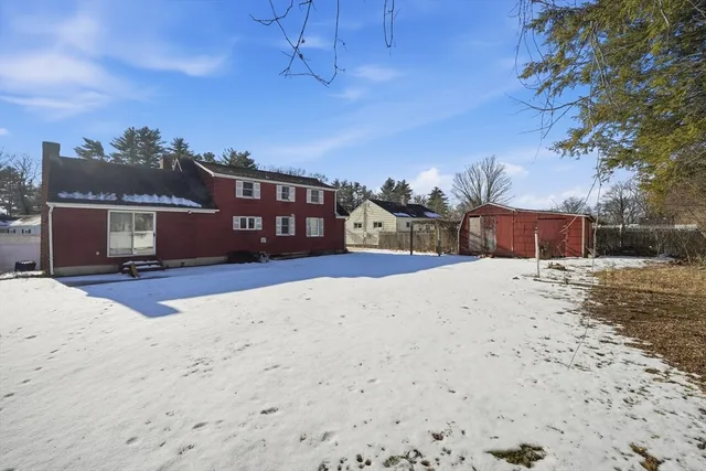 a view of a field with trees in the background