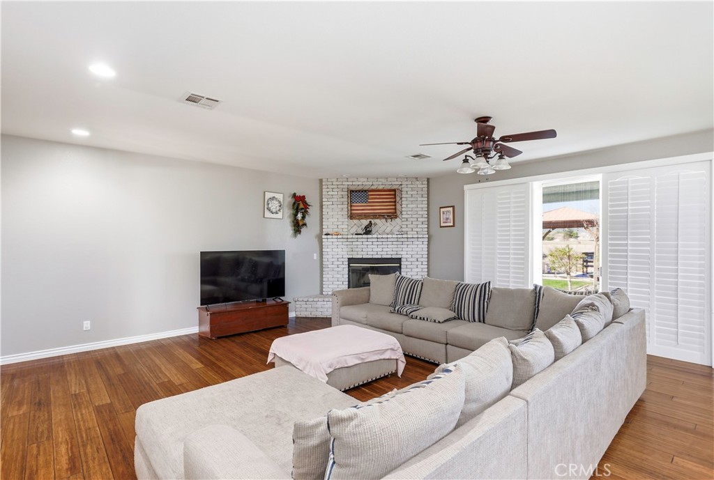 42561 25th Street West Lancaster, CA 93536 - Photo 12 of 41 a living room with furniture and a fireplace