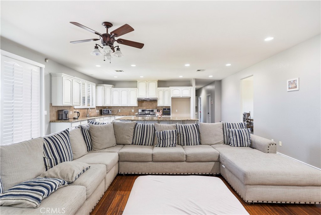42561 25th Street West Lancaster, CA 93536 - Photo 14 of 41 a living room with furniture and a ceiling fan