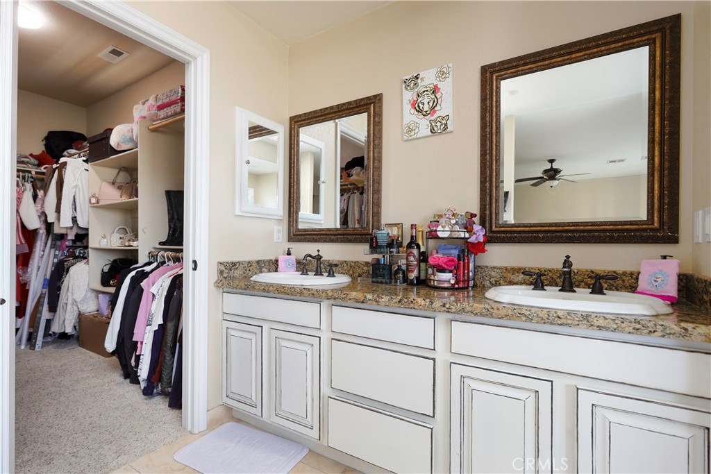 42561 25th Street West Lancaster, CA 93536 - Photo 20 of 41 a bathroom with a double vanity sink and a mirror