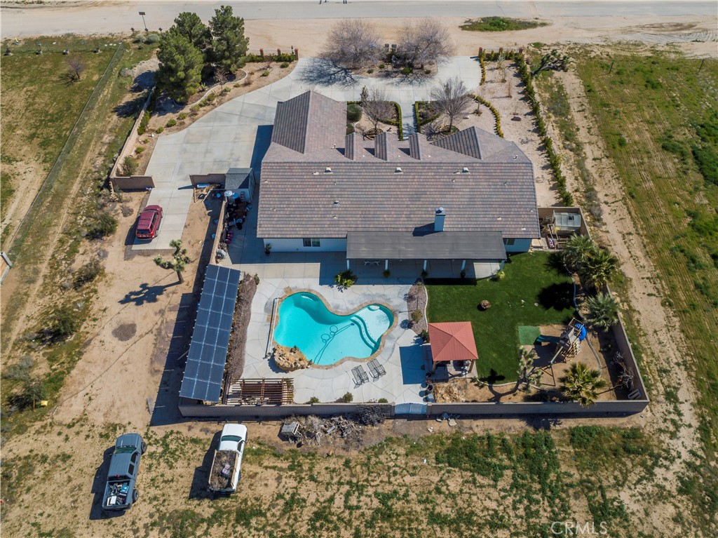 42561 25th Street West Lancaster, CA 93536 - Photo 40 of 41 an aerial view of house with yard swimming pool and outdoor seating