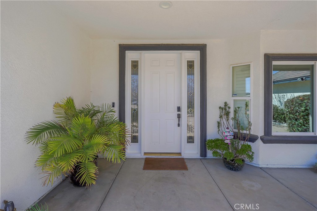 42561 25th Street West Lancaster, CA 93536 - Photo 4 of 41 a view of entryway with flower pots