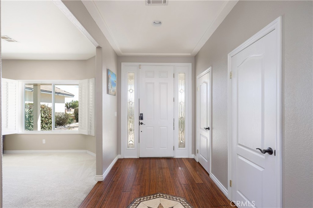 42561 25th Street West Lancaster, CA 93536 - Photo 5 of 41 a view of a room with wooden floor and a window