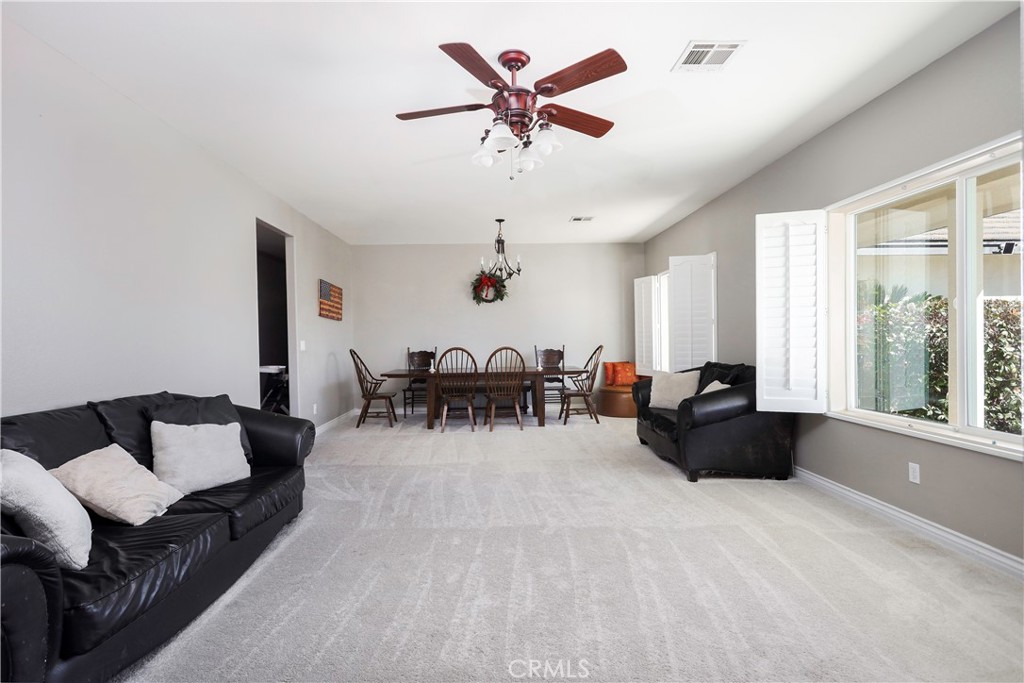 42561 25th Street West Lancaster, CA 93536 - Photo 6 of 41 a living room with furniture and a large window