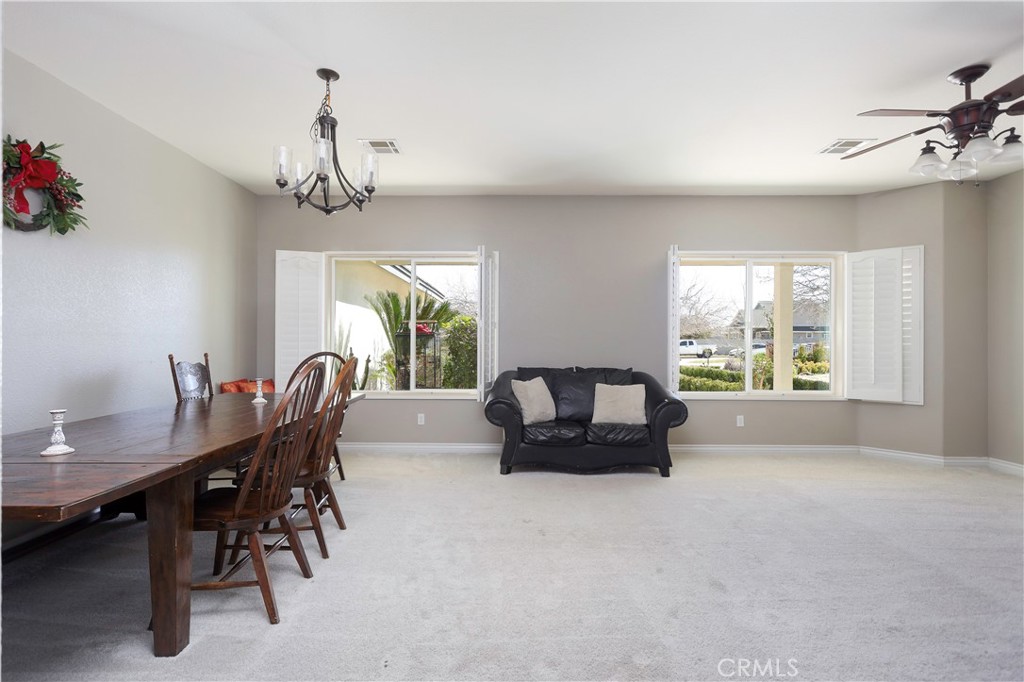 42561 25th Street West Lancaster, CA 93536 - Photo 7 of 41 a view of a dining room with furniture window and outside view