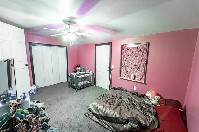 a bedroom with furniture and a chandelier