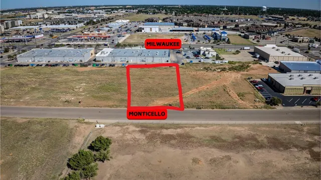 an aerial view of beach and residential space