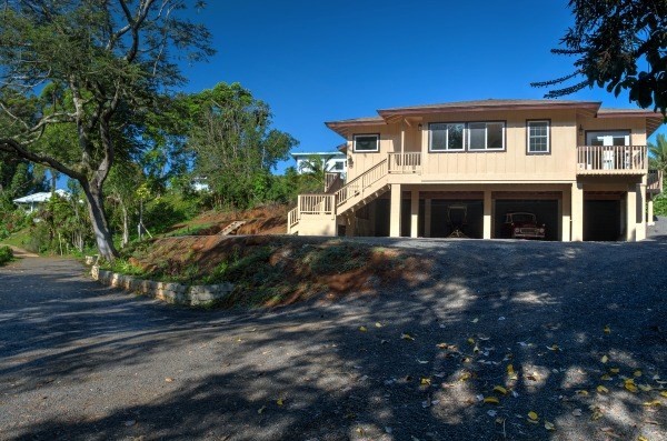 4386 Upa Road, Unit 2 Koloa, HI 96756 - Photo 21 of 25 a front view of a house with a yard