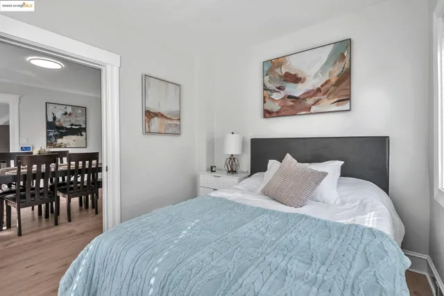 a bedroom with a bed and a table