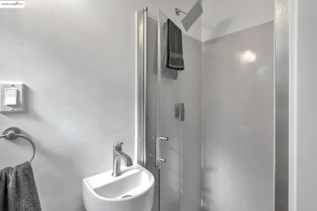 a bathroom with a sink and mirror